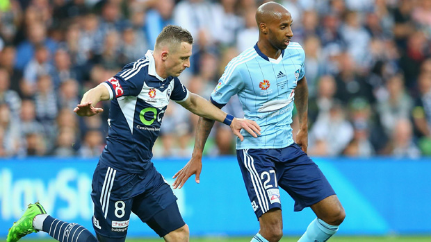Victory striker Besart Berisha fights for the ball with Sydney FC midfielder Mickael Tavares.